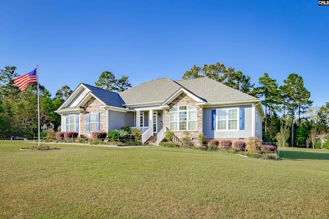 craftsman-style home with a front lawn