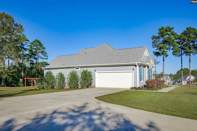 view of home's exterior with a lawn and a garage