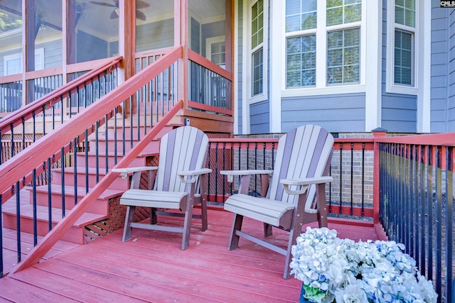 wooden deck featuring a sunroom