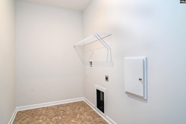 clothes washing area featuring washer hookup, hookup for an electric dryer, and a fireplace