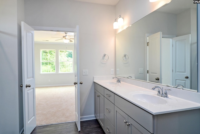 bathroom featuring vanity, wood-type flooring, and ceiling fan