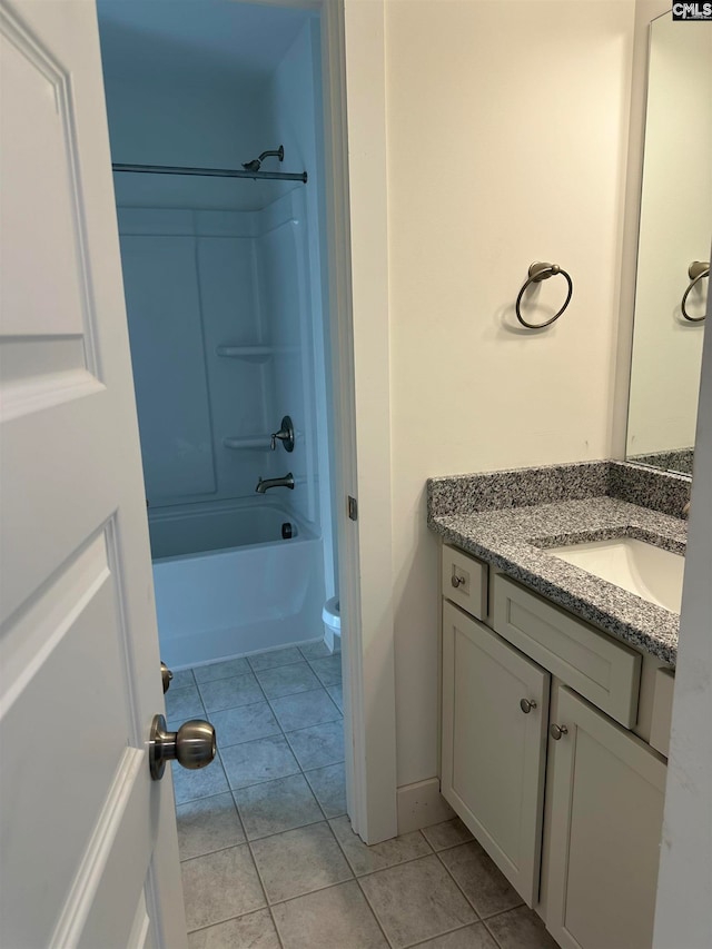 full bathroom with vanity, toilet, tile patterned floors, and  shower combination