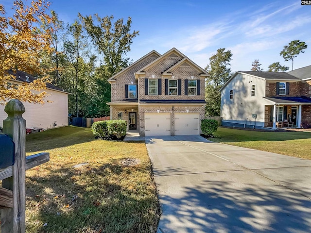 view of front of house with a front lawn and a garage