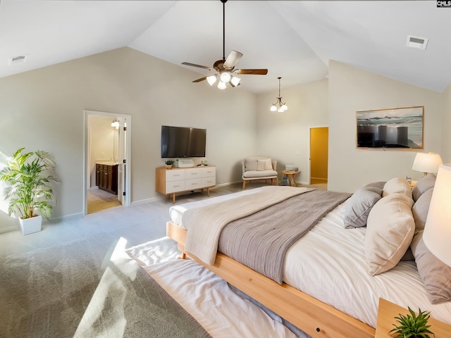 carpeted bedroom featuring ensuite bath, vaulted ceiling, and ceiling fan with notable chandelier