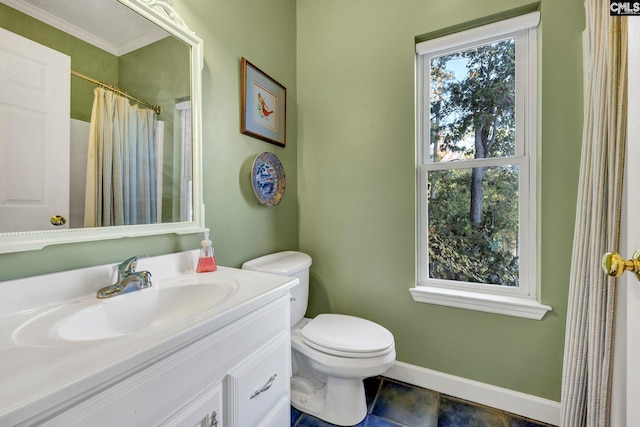 bathroom featuring vanity, ornamental molding, and toilet