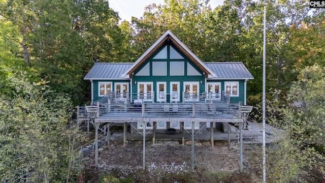 back of house featuring a wooden deck