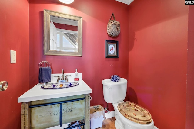 bathroom with vanity and toilet