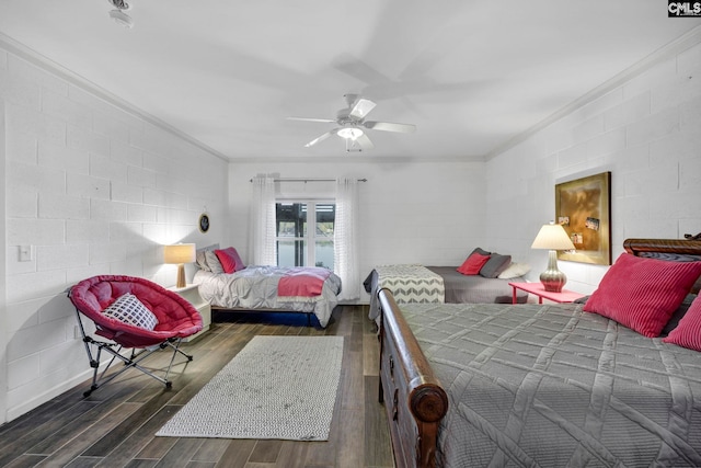 bedroom featuring ornamental molding, dark hardwood / wood-style floors, and ceiling fan