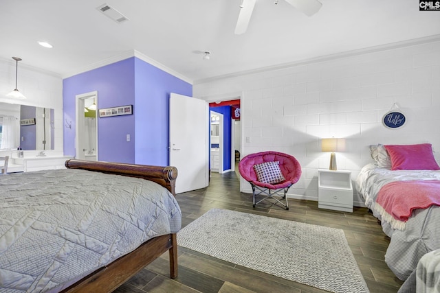 bedroom featuring dark hardwood / wood-style flooring, ornamental molding, and ceiling fan