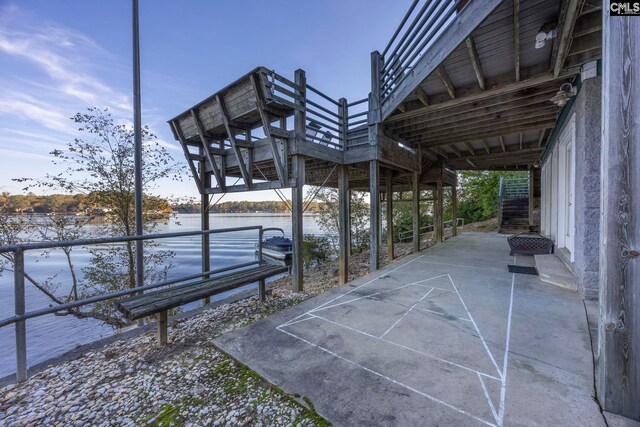 view of patio featuring a water view