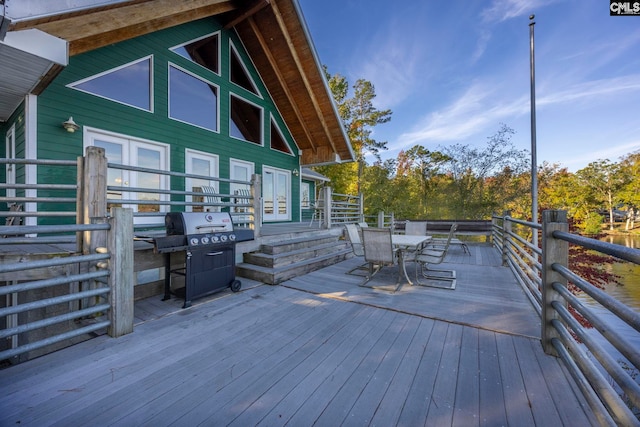 wooden terrace with area for grilling