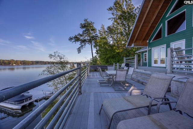 deck featuring a dock and a water view