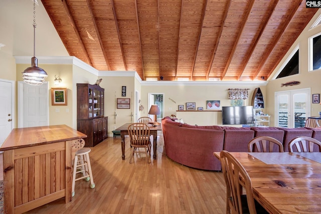 dining room with light hardwood / wood-style floors, high vaulted ceiling, wooden ceiling, and beamed ceiling