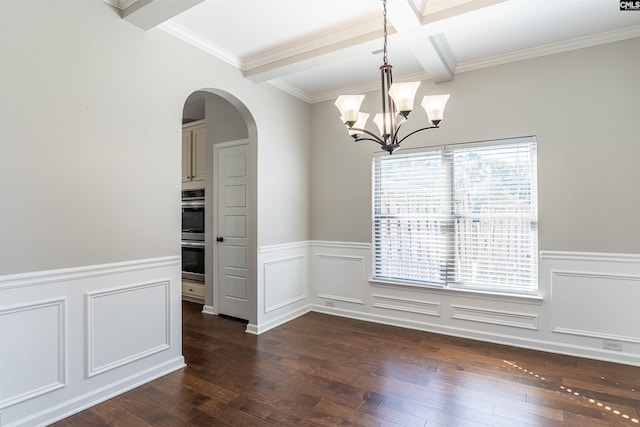 spare room featuring crown molding, beamed ceiling, dark hardwood / wood-style flooring, and an inviting chandelier