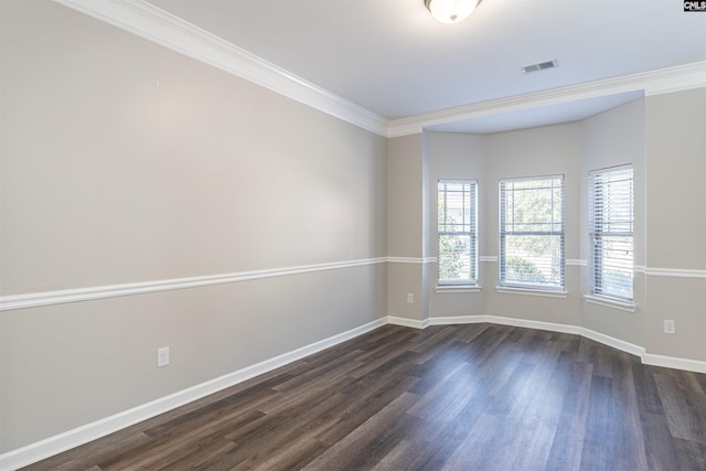 unfurnished room featuring dark wood-type flooring and crown molding