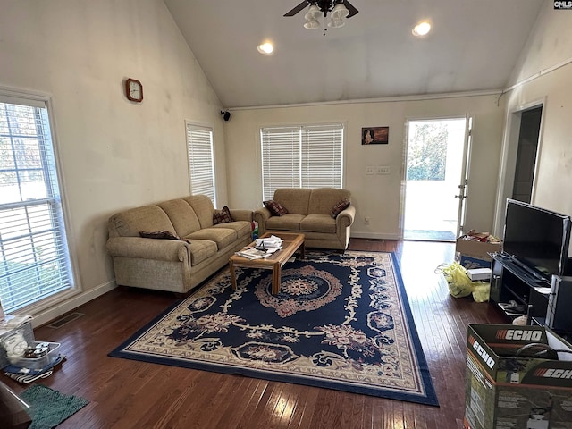 living room featuring high vaulted ceiling, a healthy amount of sunlight, and dark hardwood / wood-style floors