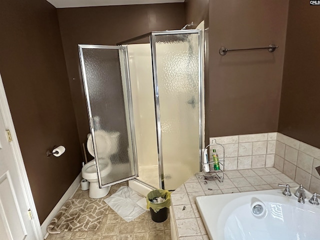 full bathroom featuring sink, shower with separate bathtub, and toilet