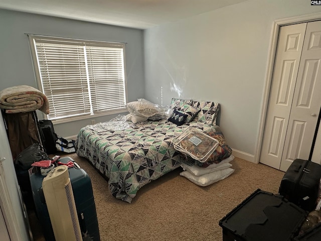 bedroom featuring a closet and carpet