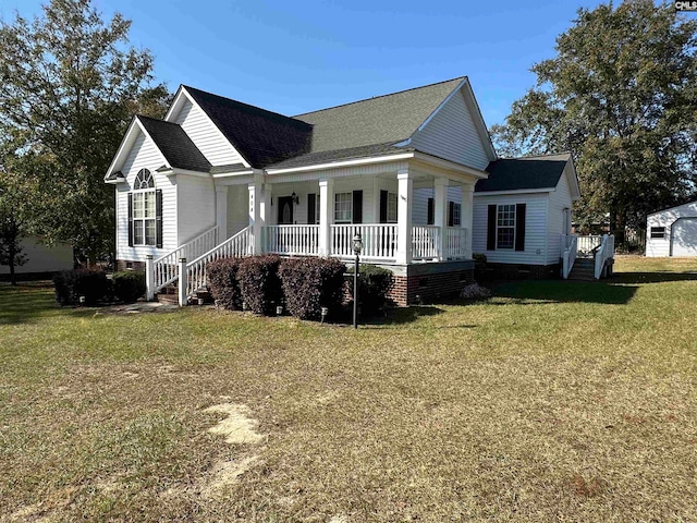 view of side of property featuring a yard and covered porch