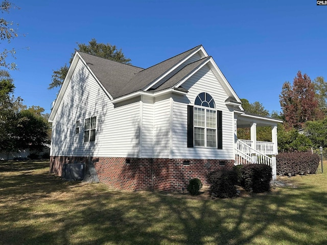 view of home's exterior featuring a yard