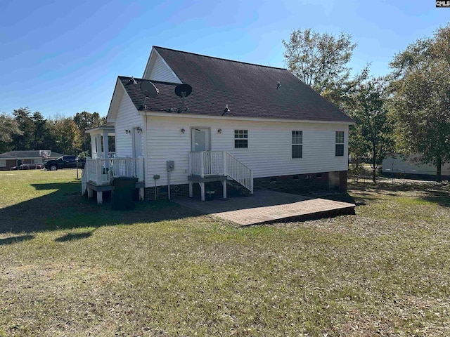 rear view of house with a lawn