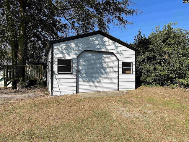 garage with a yard