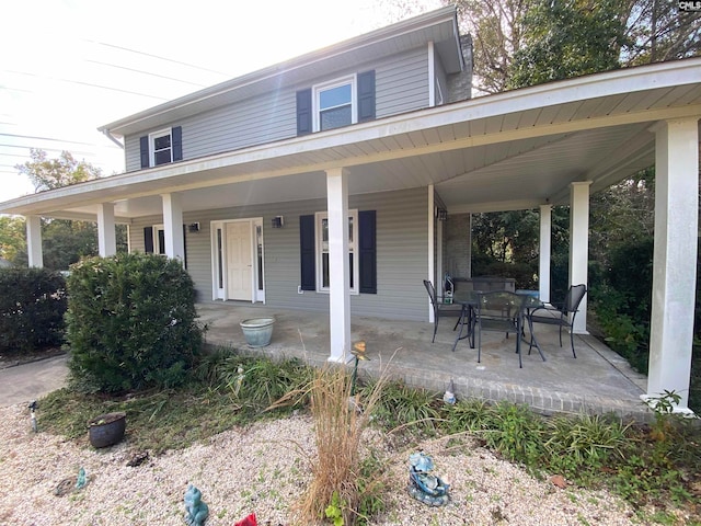 view of front facade with a patio area