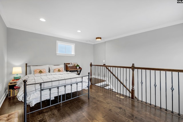 bedroom with crown molding and dark wood-type flooring