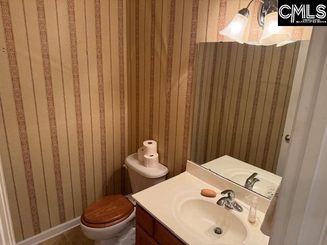 bathroom with vanity and toilet