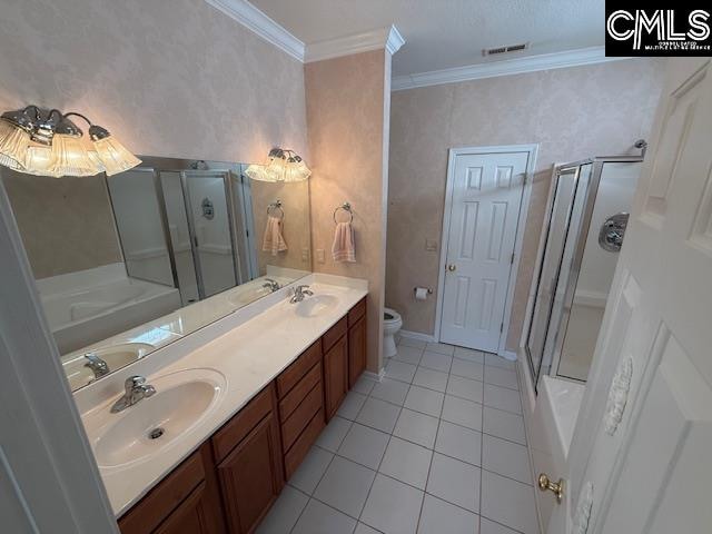 full bathroom featuring tile patterned floors, toilet, independent shower and bath, ornamental molding, and vanity