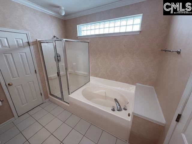 bathroom featuring tile patterned floors, crown molding, and shower with separate bathtub