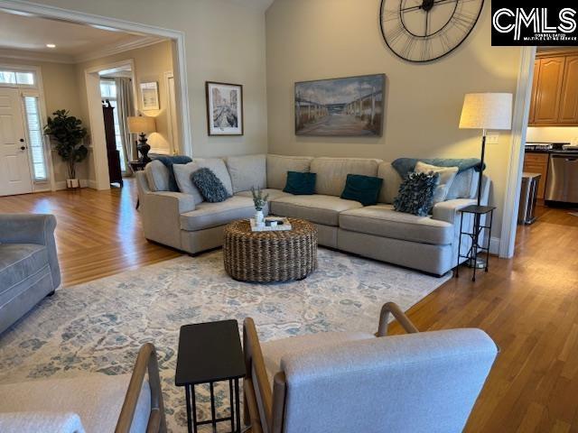 4 High Park Ct, Elgin, SC 29045 - living area featuring wood finished floors, ornamental molding, and baseboards