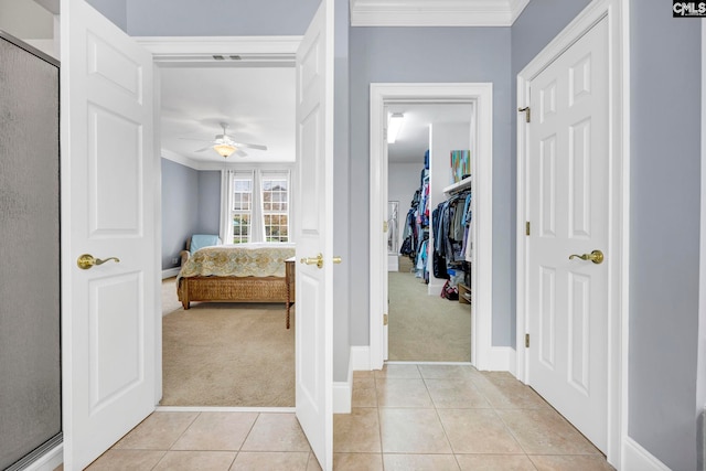 4 High Park Ct, Elgin, SC 29045 - bedroom with light carpet, light tile patterned floors, crown molding, baseboards, and a closet