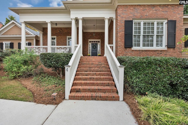 4 High Park Ct, Elgin, SC 29045 - doorway to property with brick siding and a porch