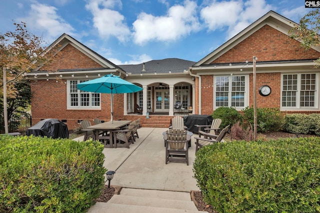 4 High Park Ct, Elgin, SC 29045 - back of property with french doors, brick siding, a patio, and an outdoor fire pit