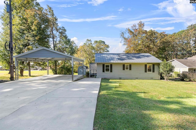 view of front of house with a front yard and a carport