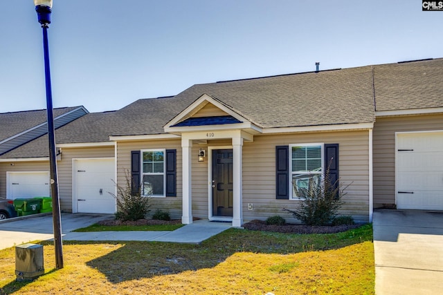 410 Pitchling Dr, Columbia, SC 29223 - multi unit property featuring a front yard, driveway, roof with shingles, and a garage