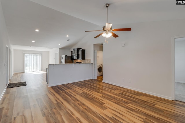410 Pitchling Dr, Columbia, SC 29223 - unfurnished living room with a ceiling fan, baseboards, washer / dryer, and light wood-style floors