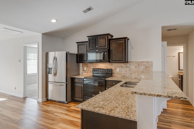 410 Pitchling Dr, Columbia, SC 29223 - kitchen with visible vents, decorative backsplash, a peninsula, a sink, and black appliances