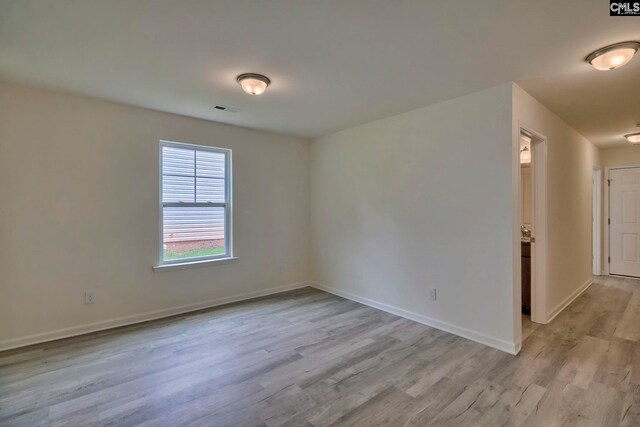 unfurnished room featuring light wood-type flooring