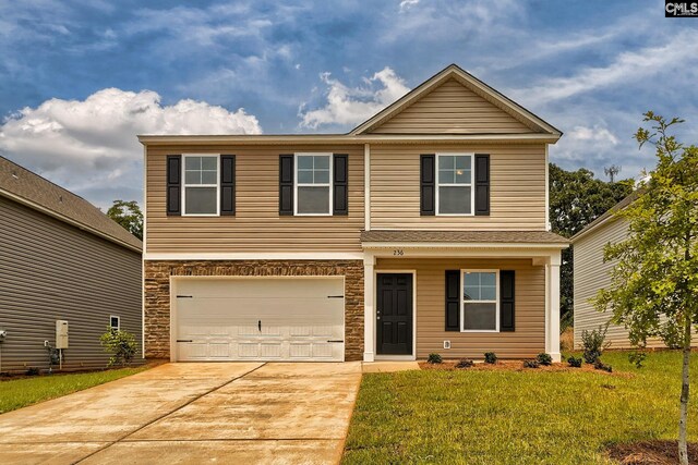 view of property with a garage and a front lawn