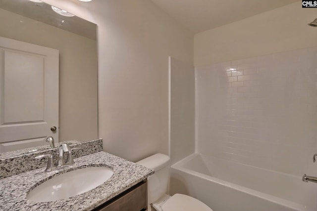 full bathroom with shower / washtub combination, vanity, and toilet