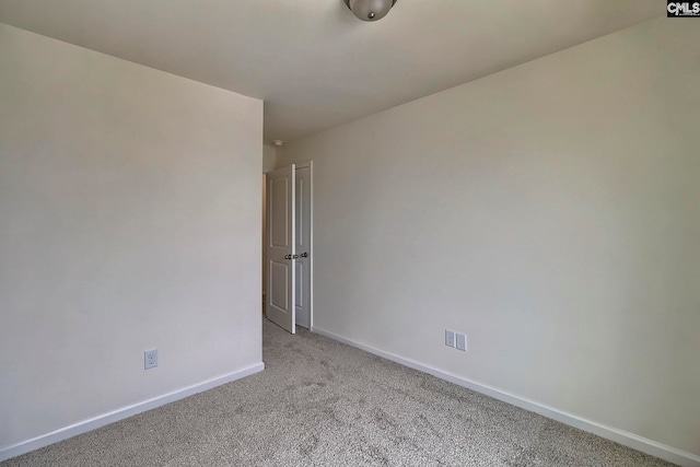 unfurnished room with light colored carpet