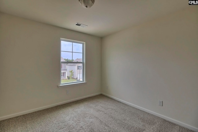 spare room featuring carpet floors