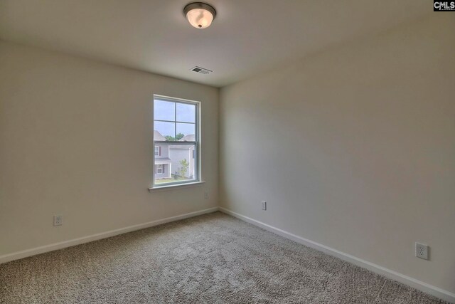 spare room featuring carpet flooring