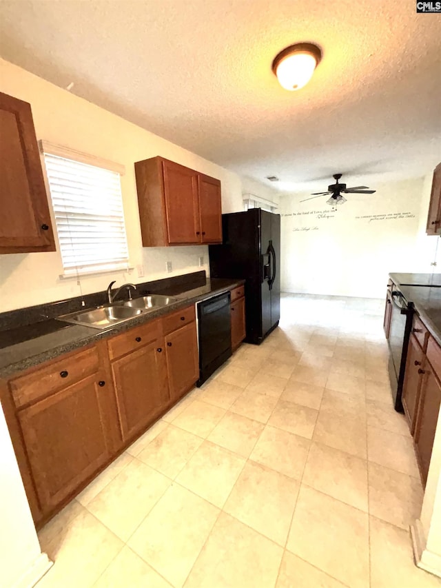 2104 Lake Carolina Dr, Columbia, SC 29229 - kitchen with black appliances, a sink, a textured ceiling, ceiling fan, and dark countertops