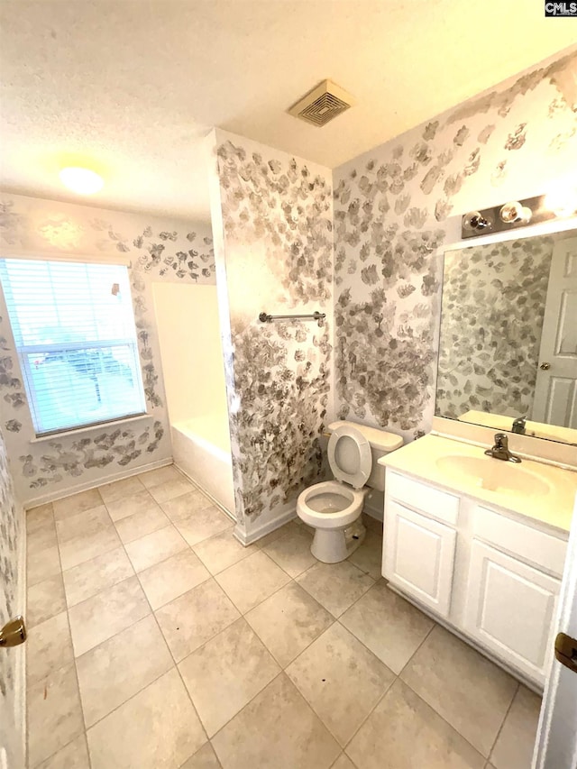 2104 Lake Carolina Dr, Columbia, SC 29229 - full bath with wallpapered walls, vanity, toilet, a tub to relax in, and tile patterned flooring