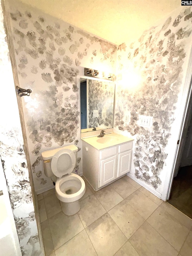 2104 Lake Carolina Dr, Columbia, SC 29229 - half bath featuring wallpapered walls, baseboards, vanity, toilet, and tile patterned floors