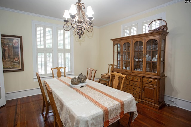 dining room featuring a healthy amount of sunlight, ornamental molding, a chandelier, and dark hardwood / wood-style floors