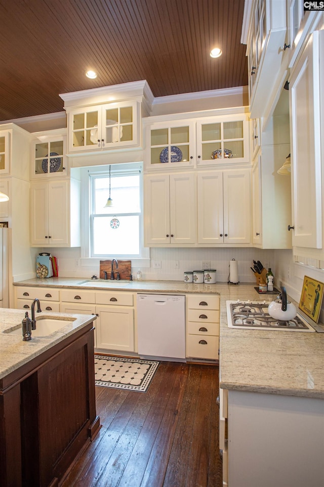 kitchen featuring dark hardwood / wood-style flooring, white cabinetry, sink, and white appliances